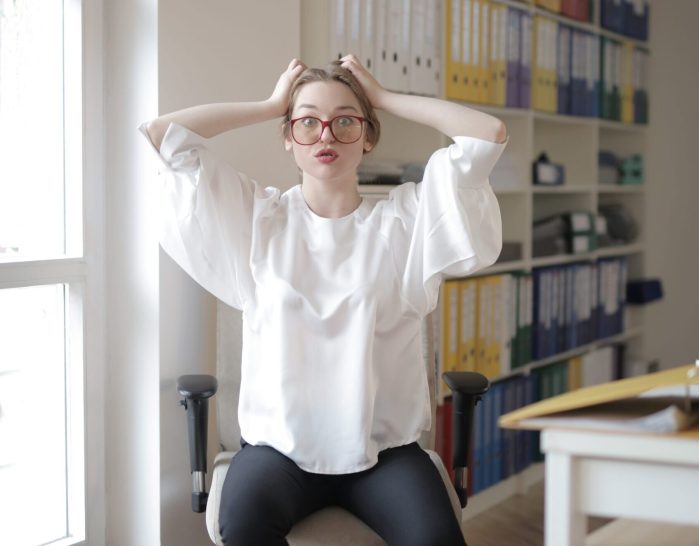 Shocked female worker in modern workplace