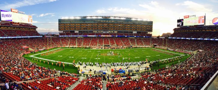 Nfl stadium field full with crowd watching the game during daytime